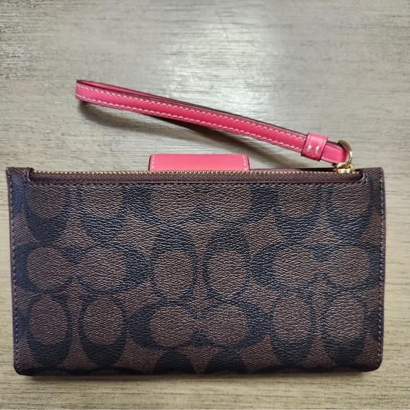 Coach Wallet Signature Color Block
Brown/Watermelon. Excellent condition. - Picture 3 of 5